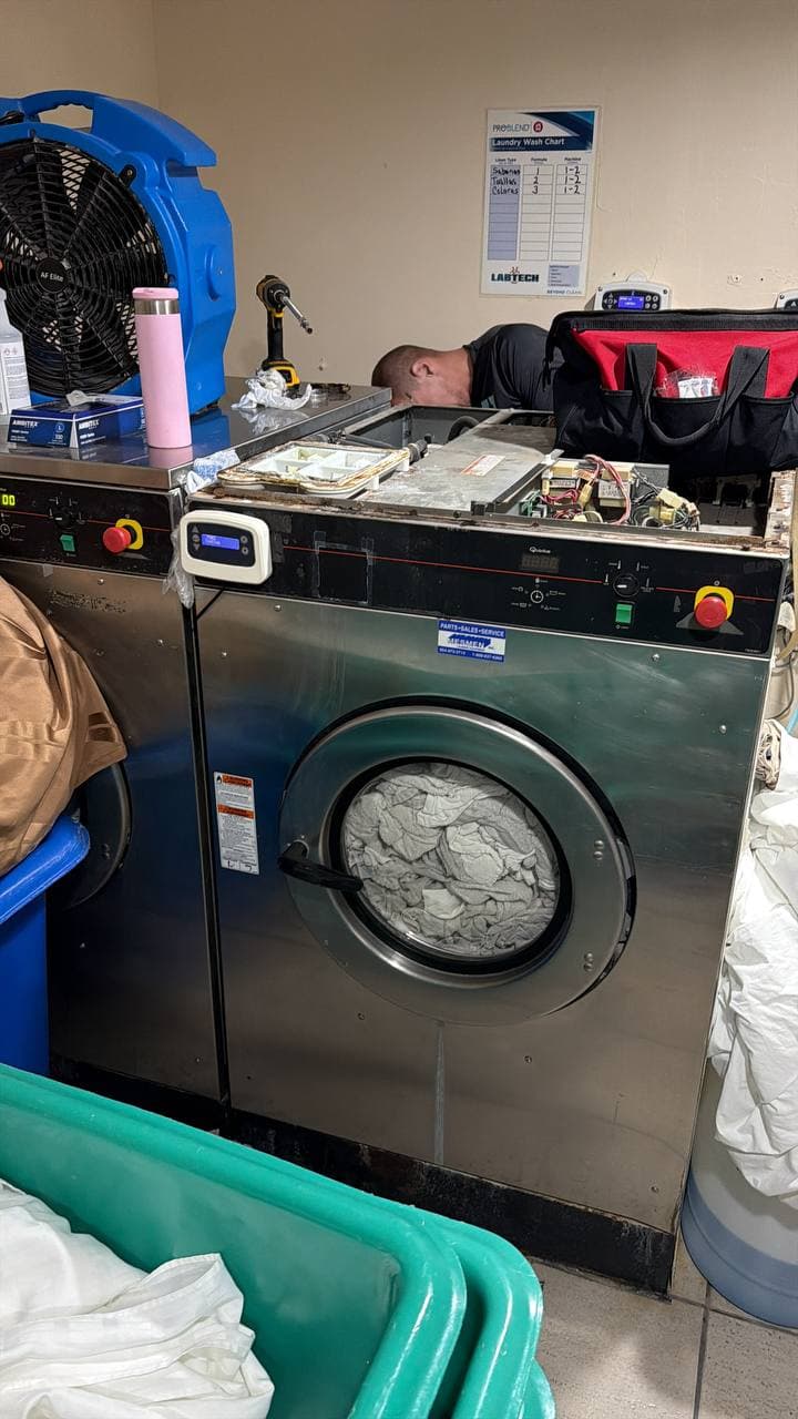 SameDay ApplianceFix technician servicing commercial washer
