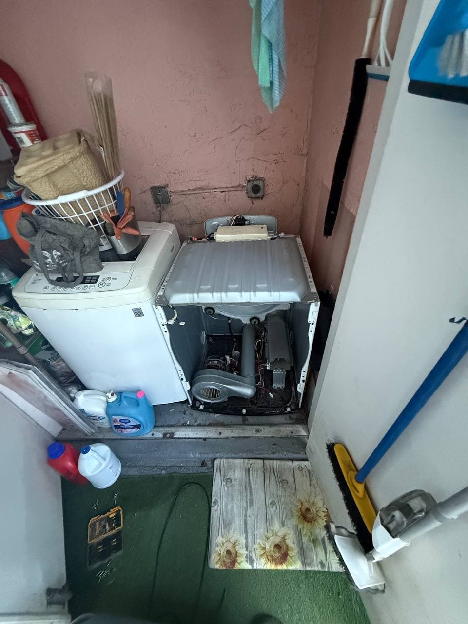SameDay ApplianceFix technician repairing washer in Palm Beach County home