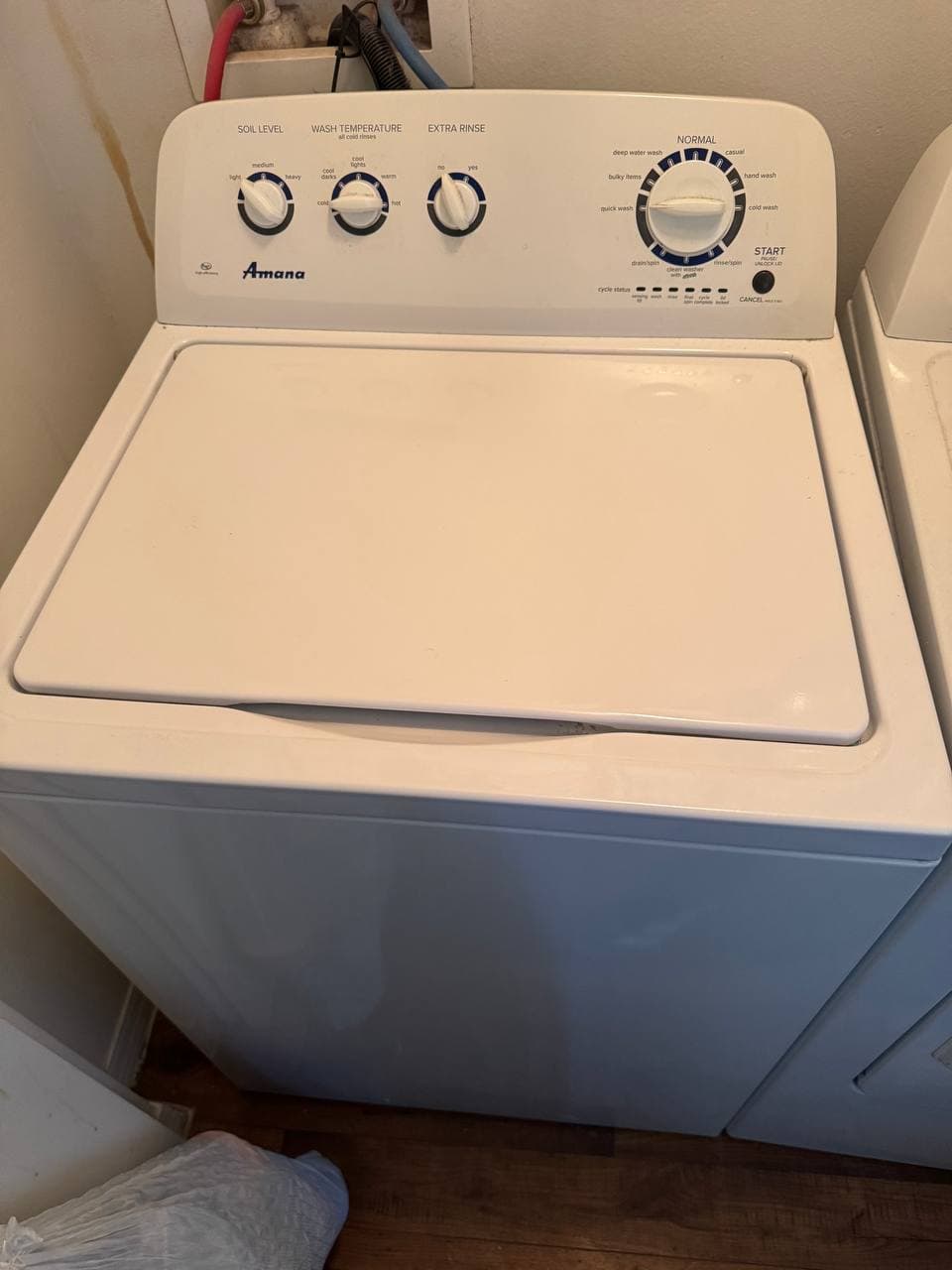 Washer Repair by Same Day Appliance Fix — Palm Beach County FL | Call $<span className="tabular">{BUSINESS.phone}</span> Amana top-load washer serviced — agitator and drain pump inspection in residential laundry room
