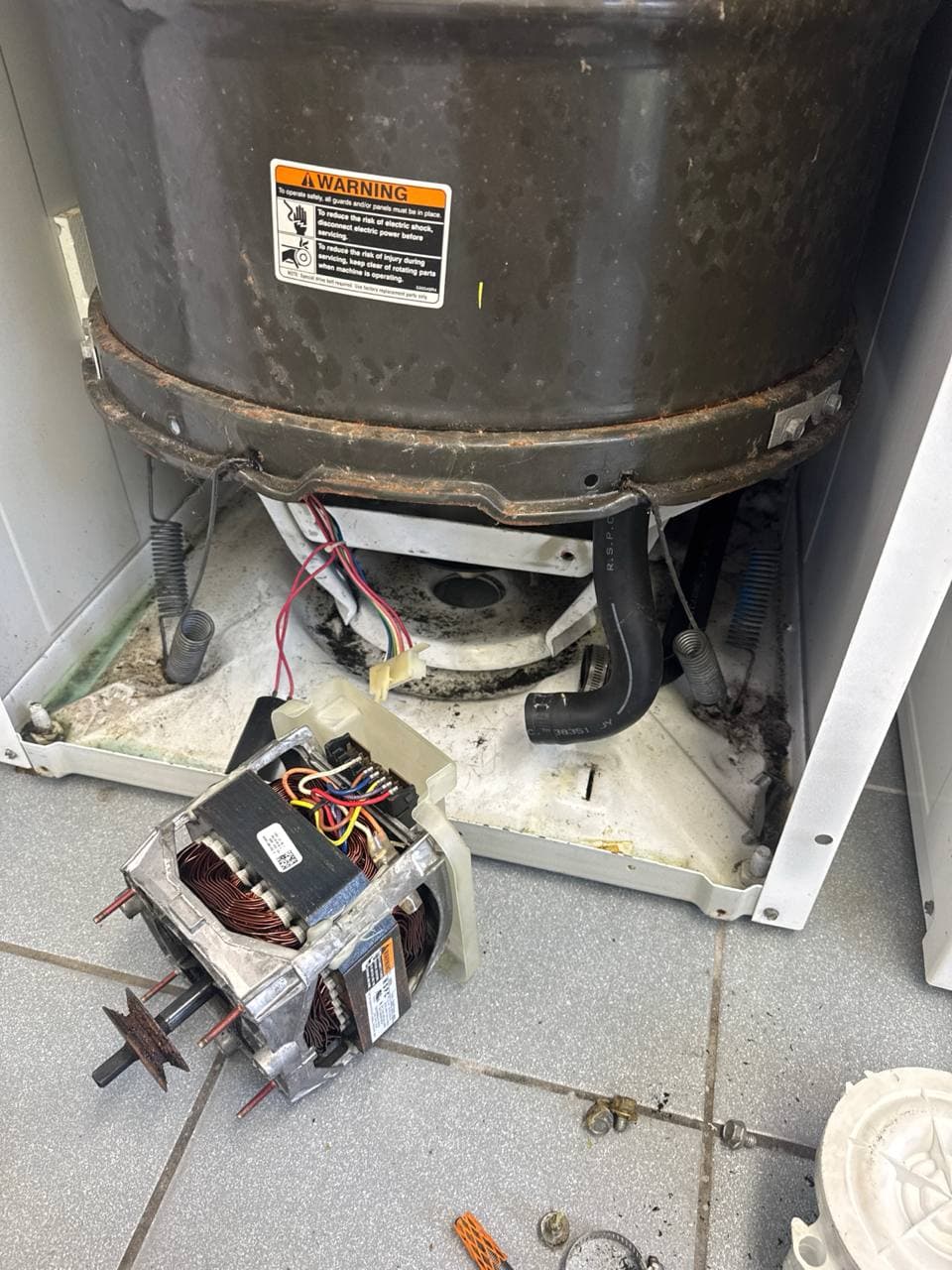 Washer Repair by Same Day Appliance Fix — Palm Beach County FL | Call $<span className="tabular">{BUSINESS.phone}</span> Washing machine motor and drive coupling replacement — internal components exposed during repair